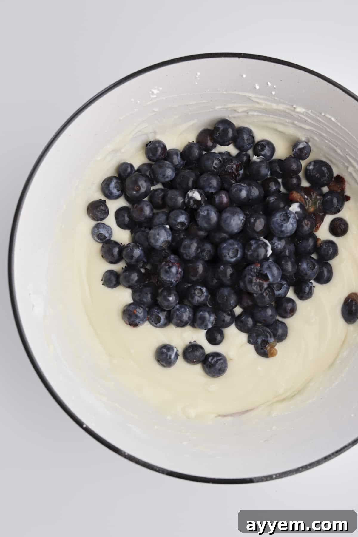 cream cheese filling with fresh blueberries in a bowl