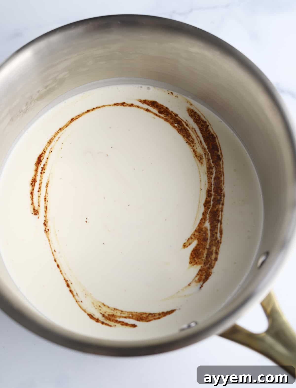 Espresso Infused Crème Brûlée 3 heavy cream, vanilla bean paste, espresso powder, and salt in a pot
