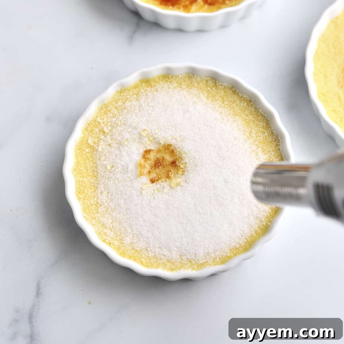 Espresso Infused Crème Brûlée 6 a blow torch torching creme brulee