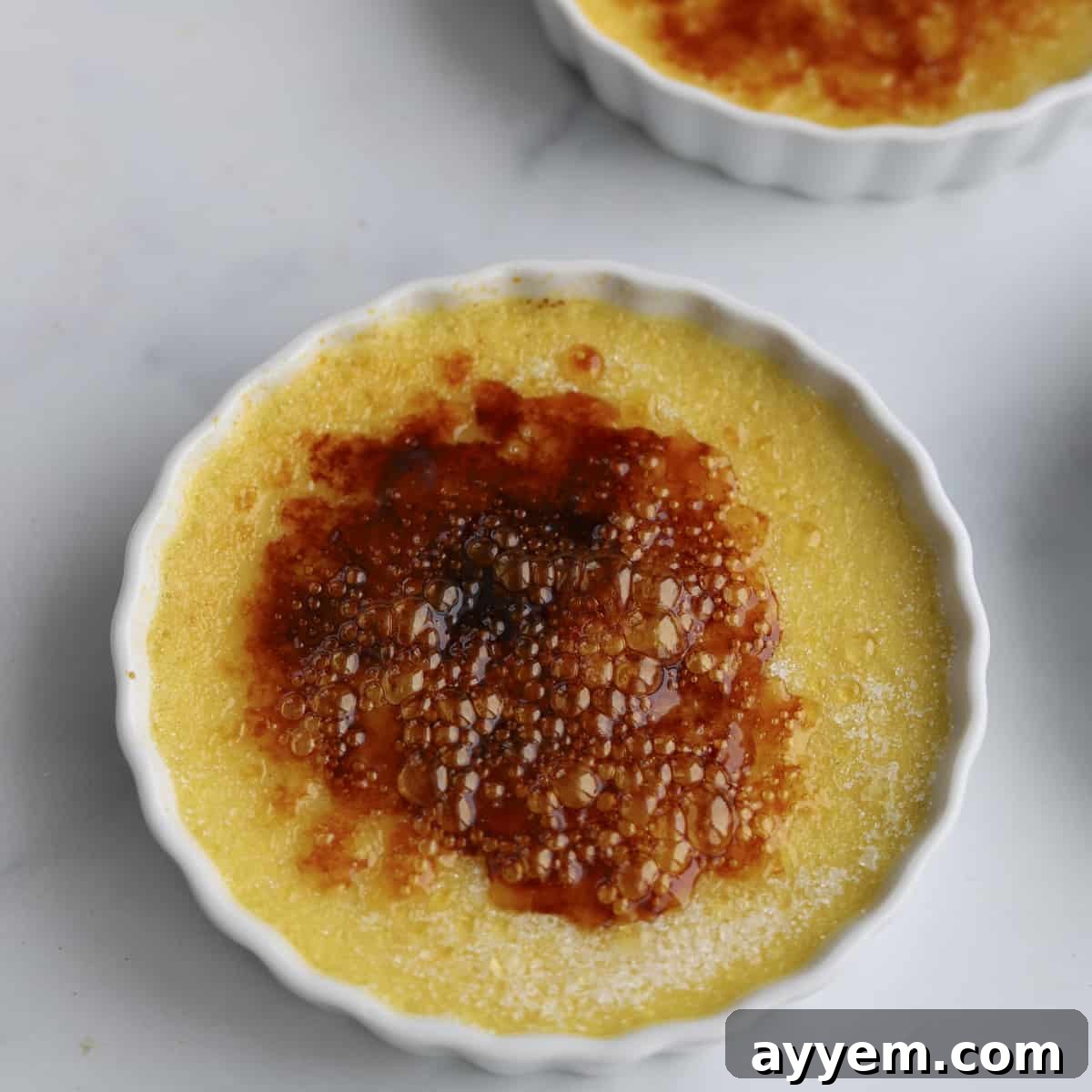 Espresso Infused Crème Brûlée 8 caramelized sugar over creme brulee in a ramekin
