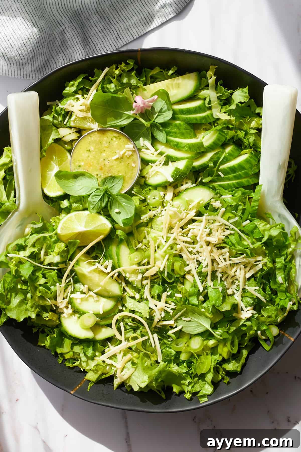 A bowl of green goddess salad. 