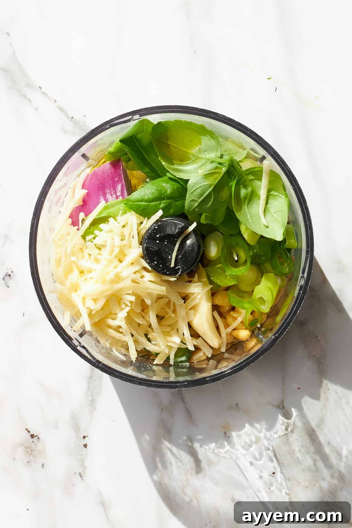 Ingredients for green goddess dressing in a food processor. 