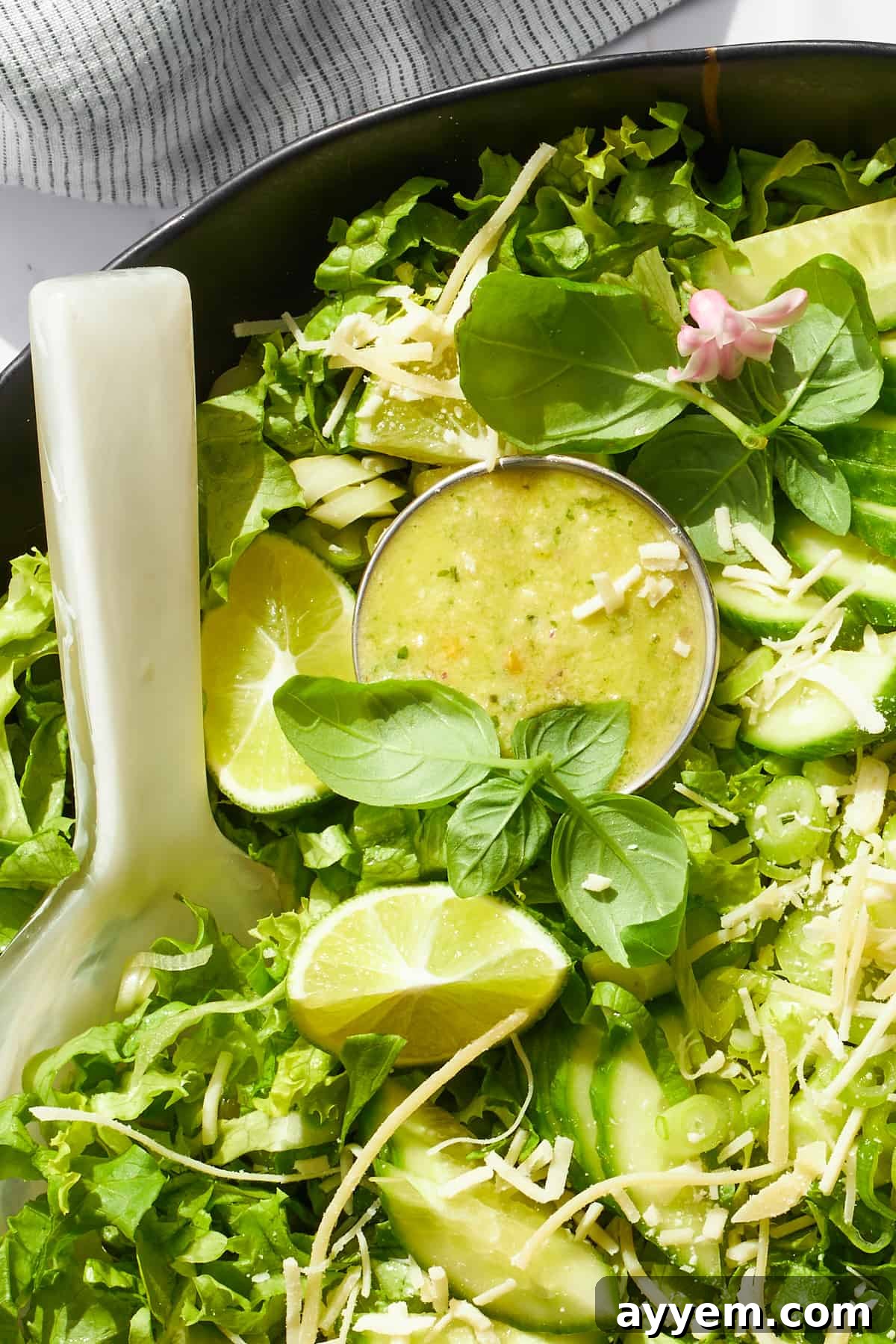 Green goddess dressing nestled on top of a salad. 