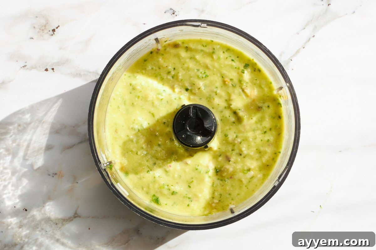 Green goddess dressing in a food processor.