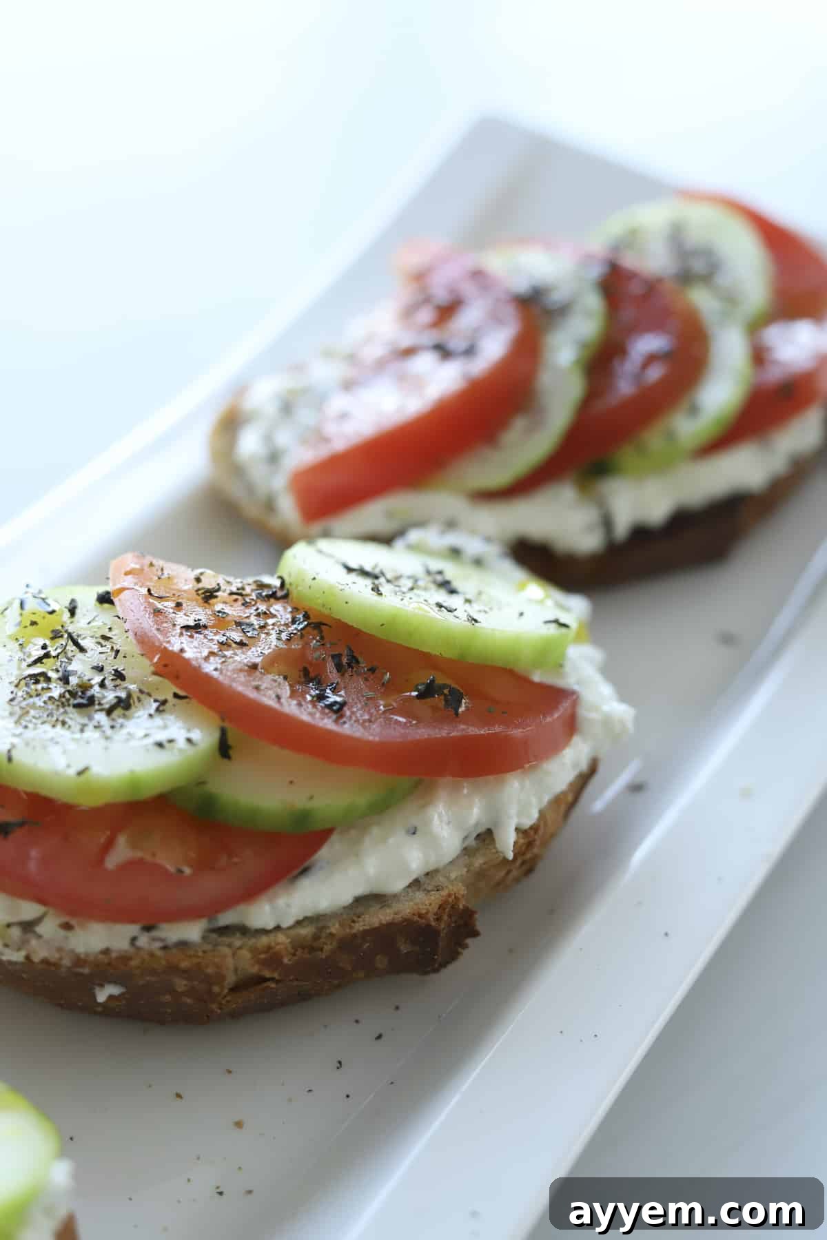 feta toast with tomatoes and cucumbers and dried mint