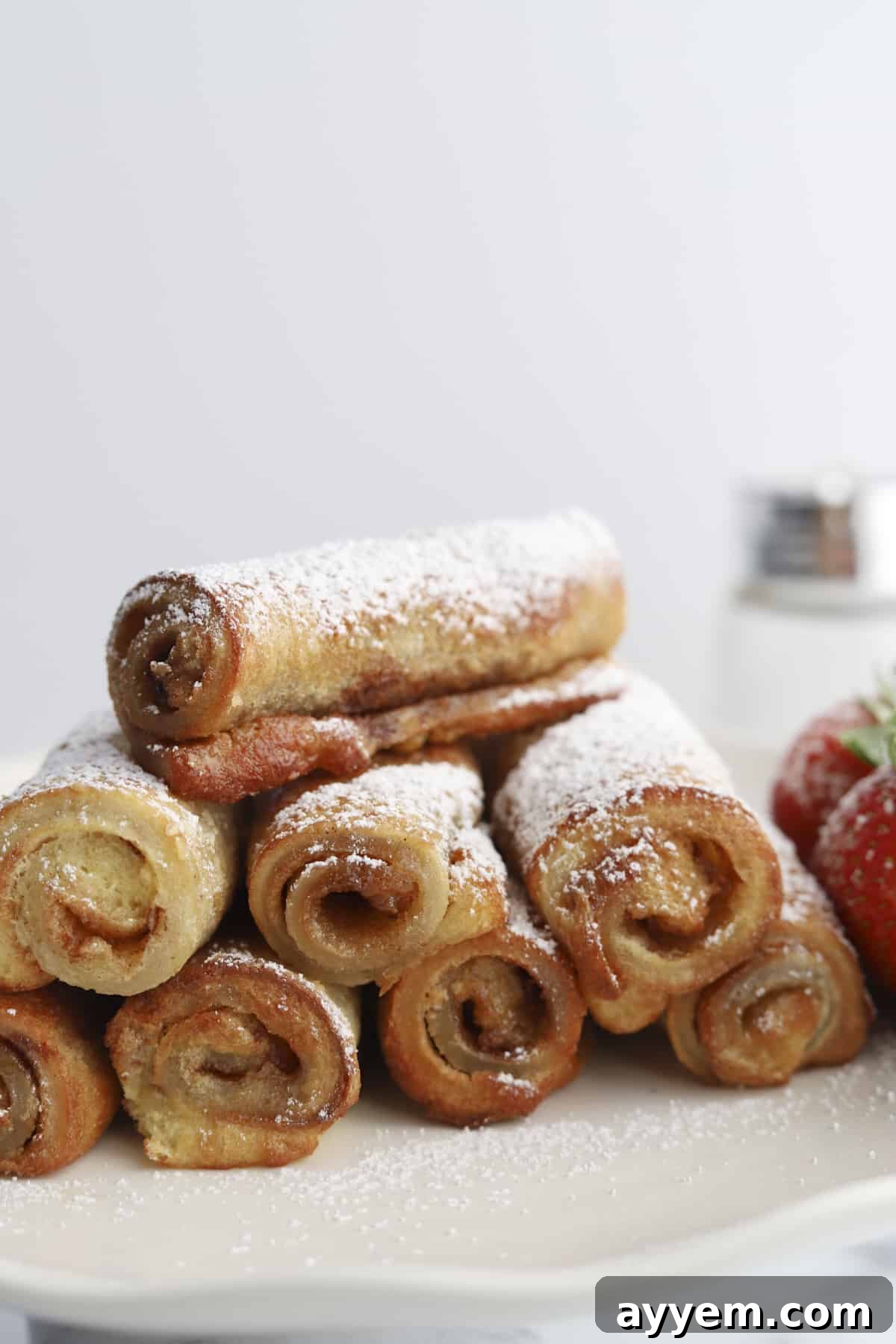 plate of cinnamon roll french toast roll ups