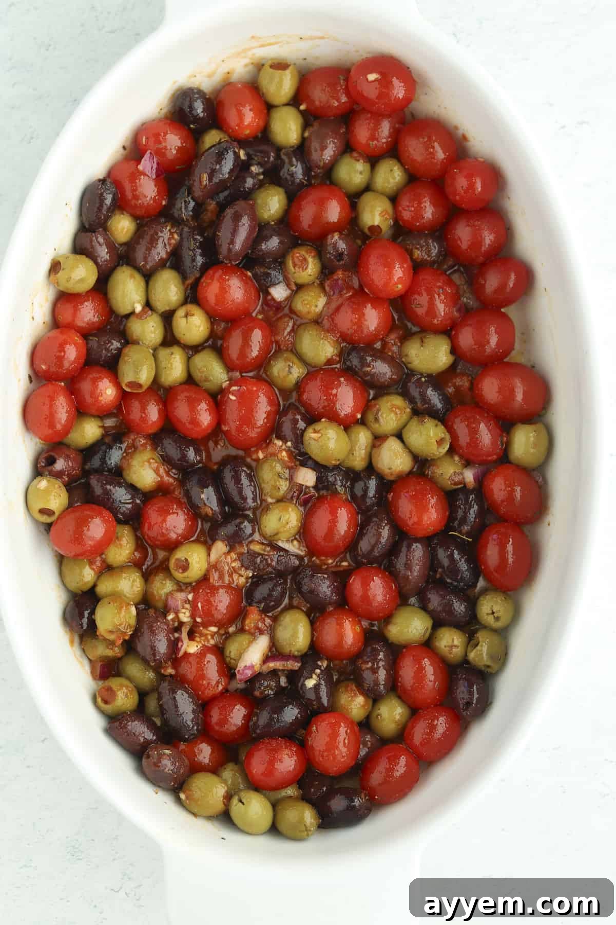 overhead baking dish with tomatoes and olives