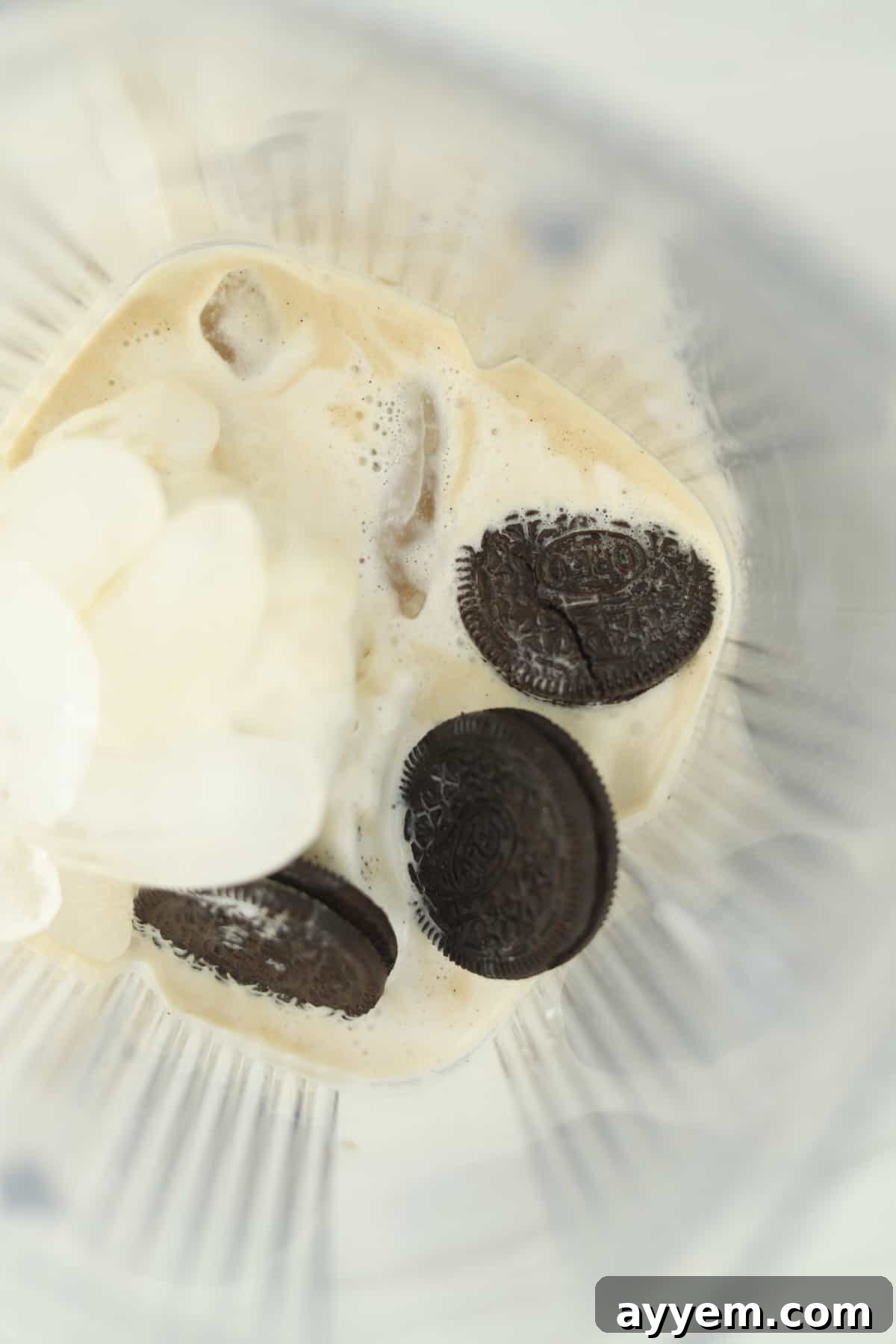 blender of milk, ice, ice cream, and oreos