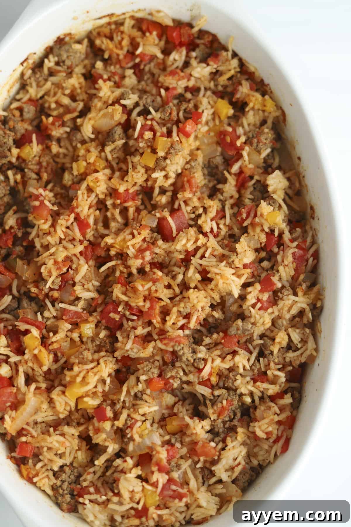 A freshly baked Stuffed Pepper Rice Bake, still in its baking dish, garnished and ready to be served.