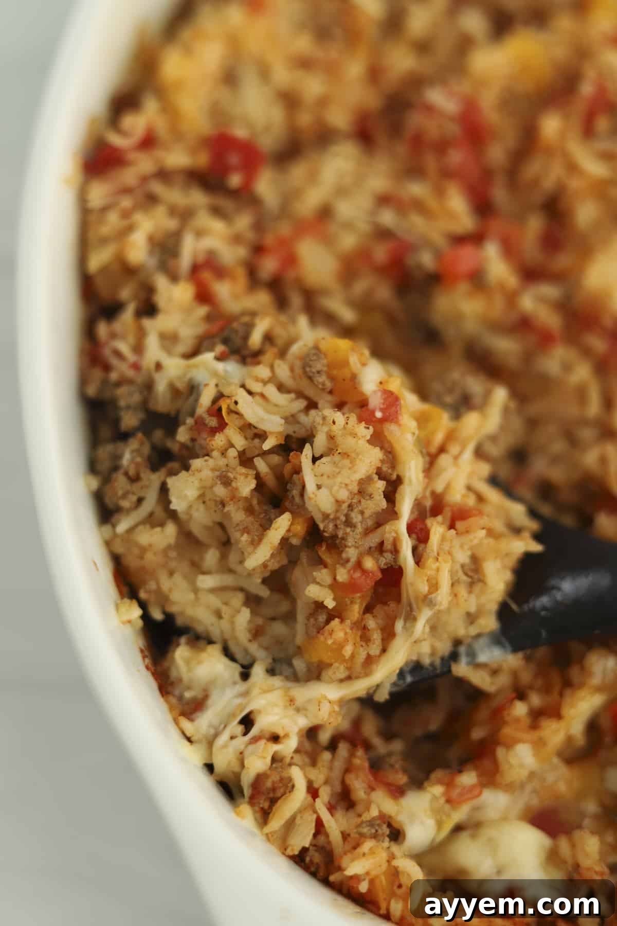 A close-up shot of the cooked rice in the Stuffed Pepper Rice Bake, showing its perfectly fluffy texture.