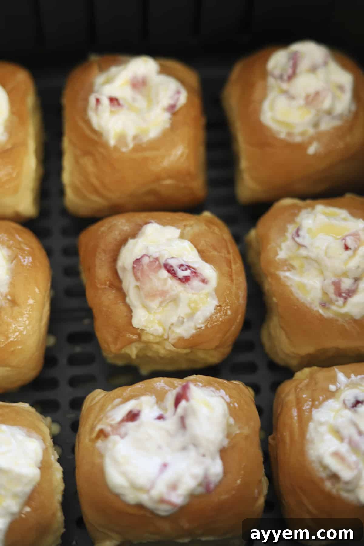 strawberry cream cheese stuffed Hawaiian rolls in an air fryer