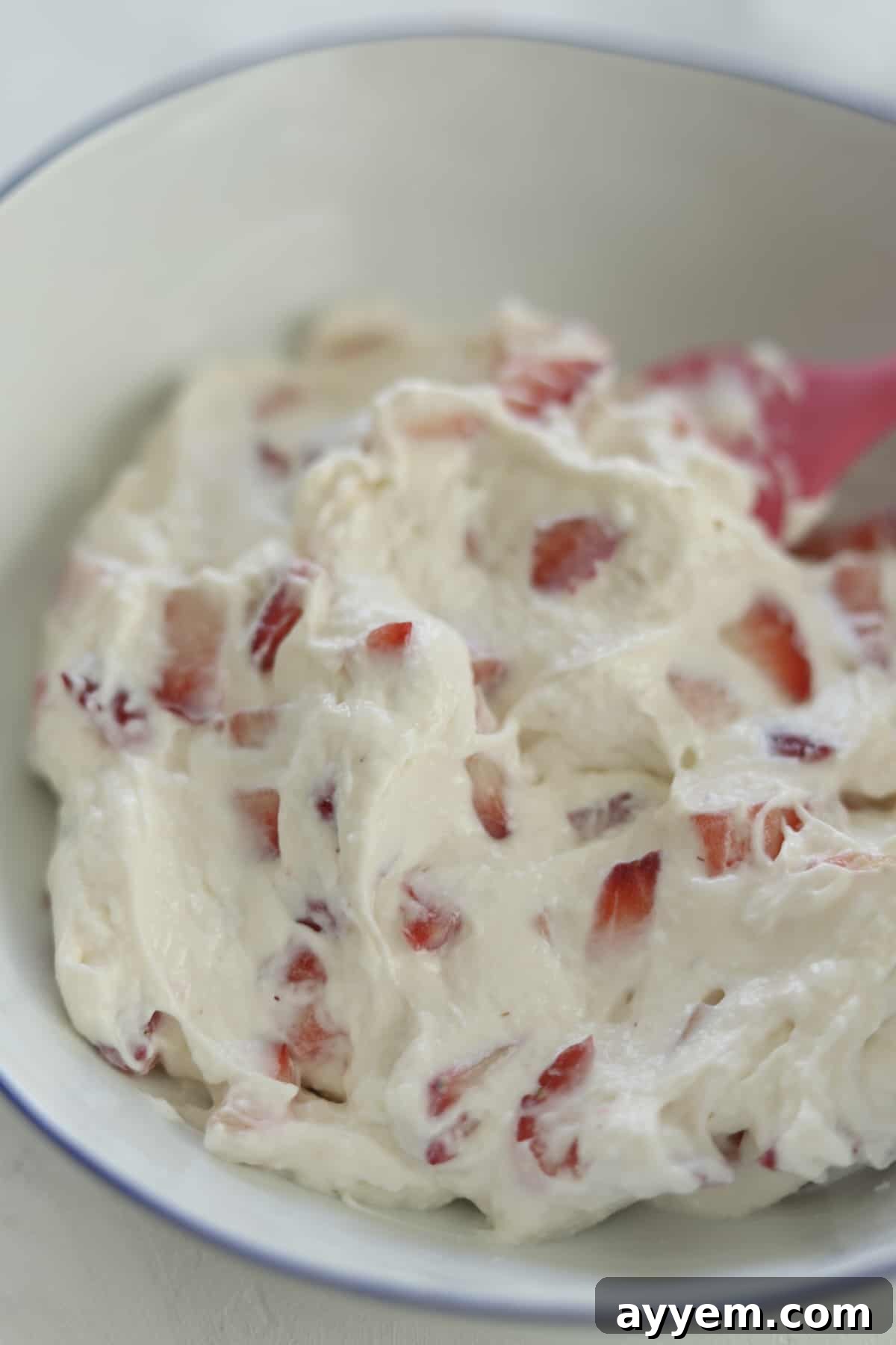 whipped cream mixture with chopped strawberries