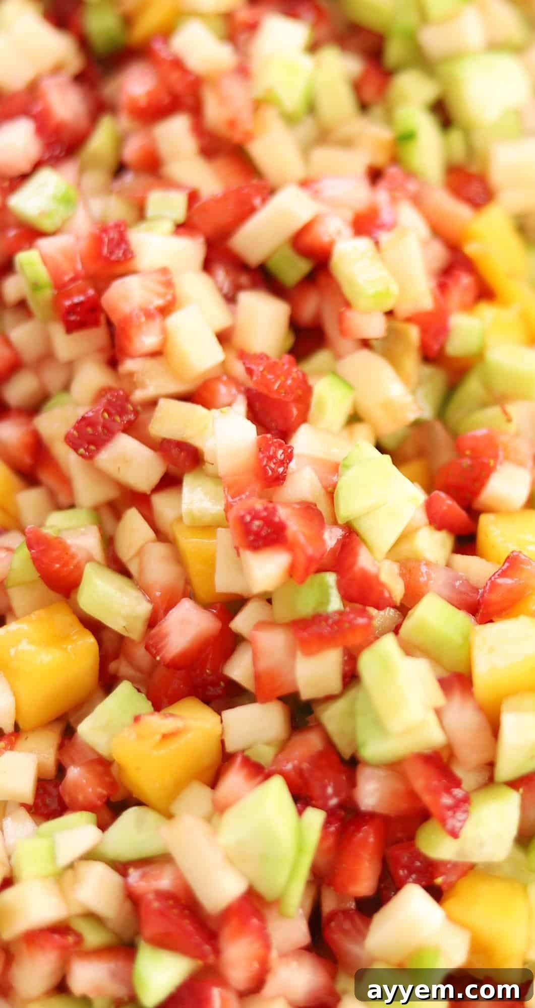 A close-up view of the fruit salad mix, highlighting the vibrant colors and diced pieces.