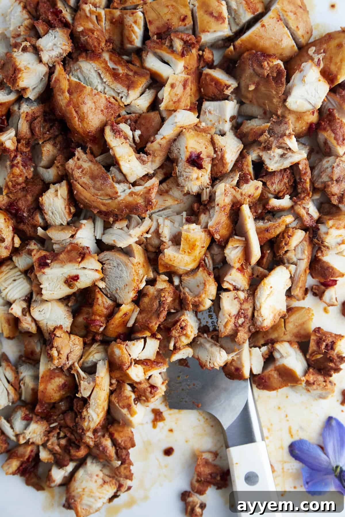 Perfectly seasoned, chopped chipotle chicken ready to be added to a homemade burrito bowl.