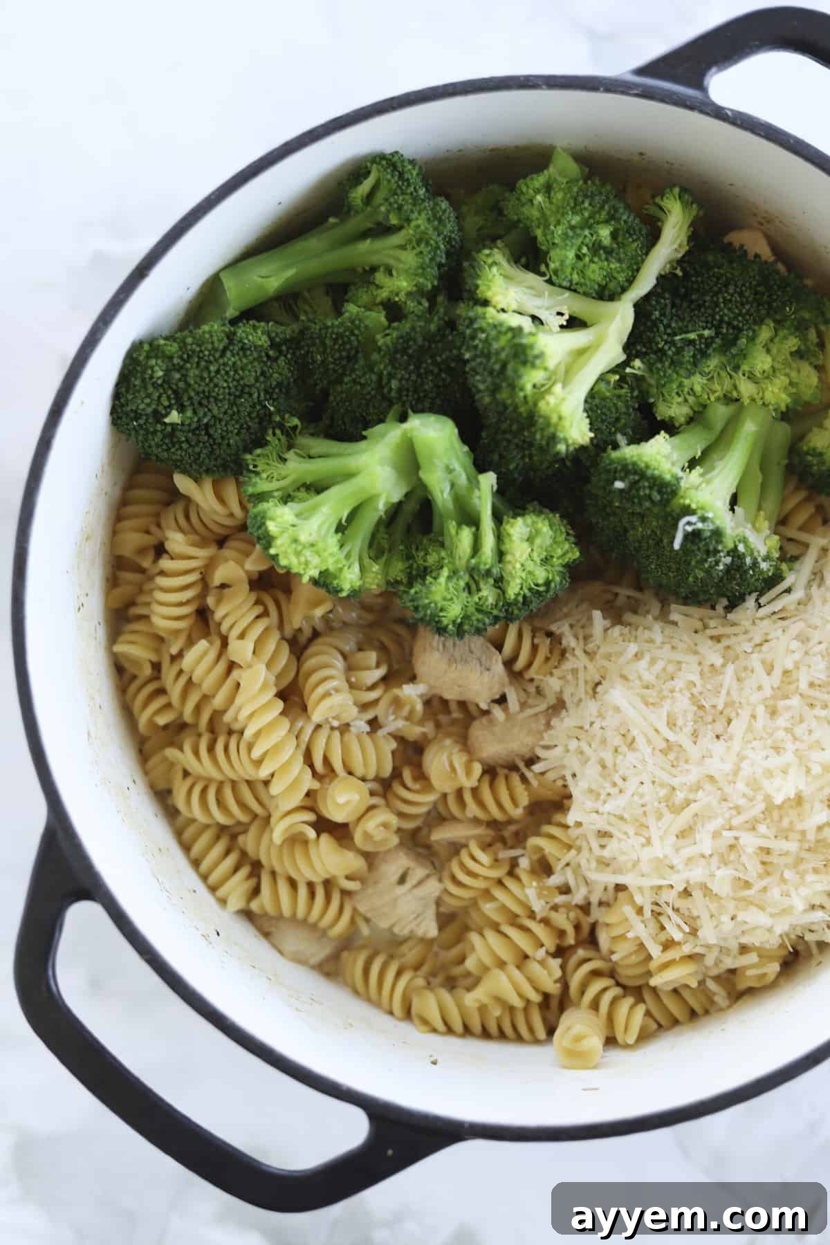 A tantalizing view of the finished One-Pot Chicken Broccoli Rotini, perfectly creamy with melted Parmesan and vibrant green broccoli.