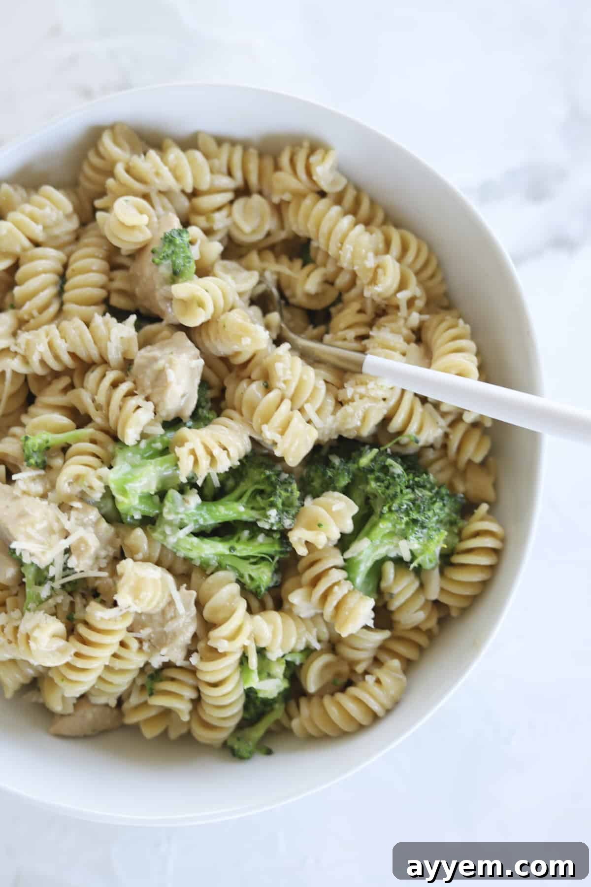 A serving bowl of One-Pot Chicken Broccoli Rotini, ready to be enjoyed, highlighting the creamy sauce and fresh ingredients.