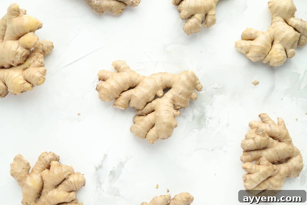 Fresh ginger root resting on a rustic wooden table, ready for storage and culinary use.