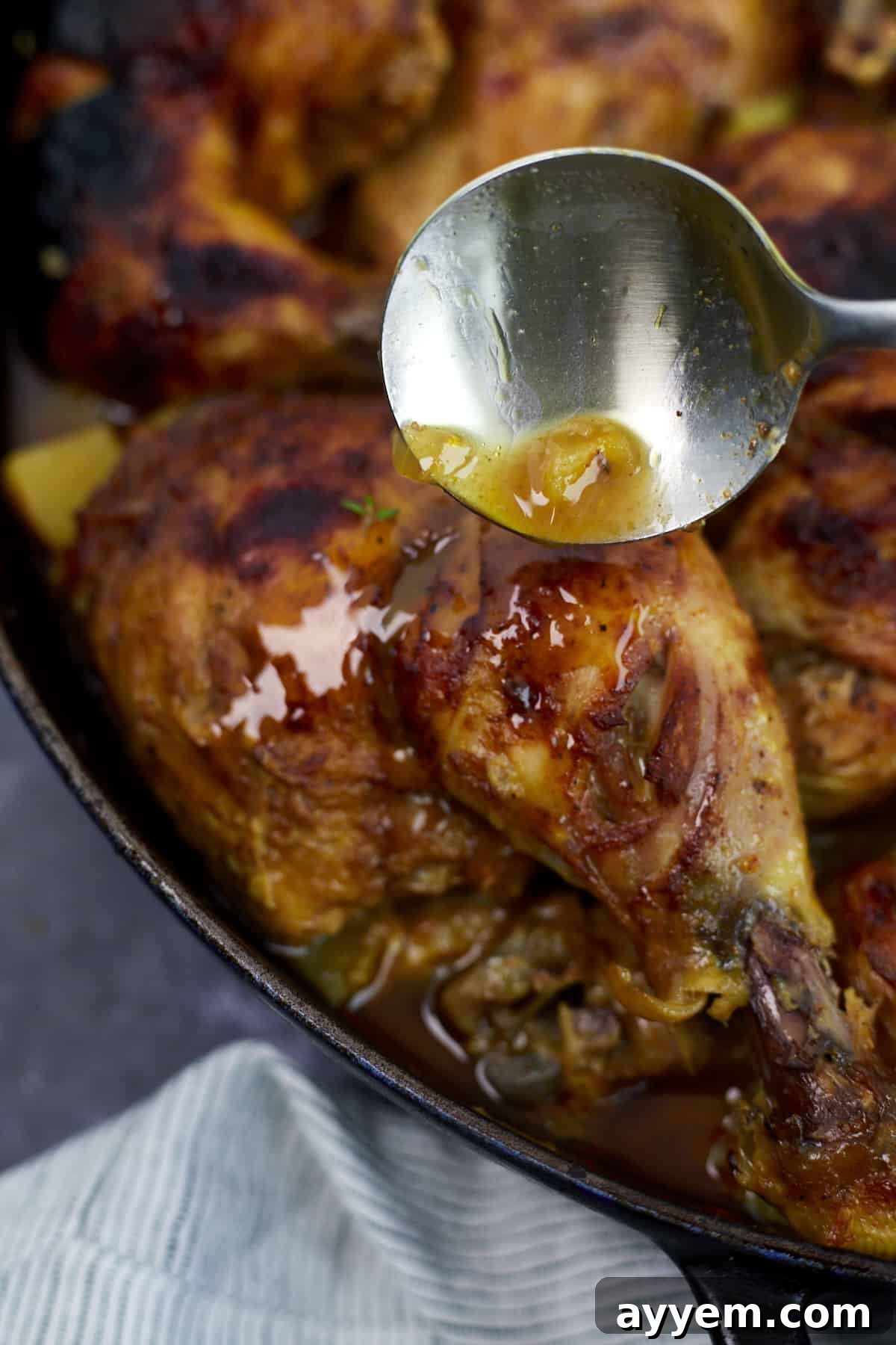 Close-up of Middle Eastern spiced chicken and potato wedges, perfectly roasted and golden brown, garnished with fresh parsley.