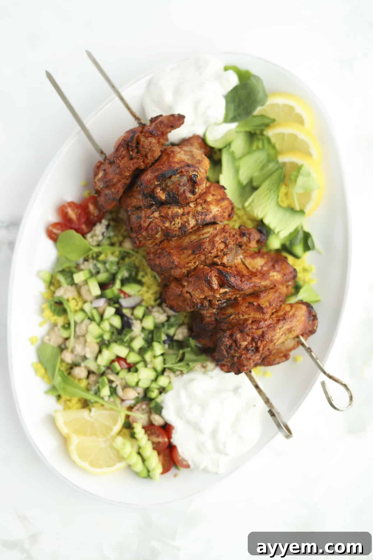 Chicken Shawarma skewers grilling to golden perfection, showcasing the delicious charred edges and tender meat.