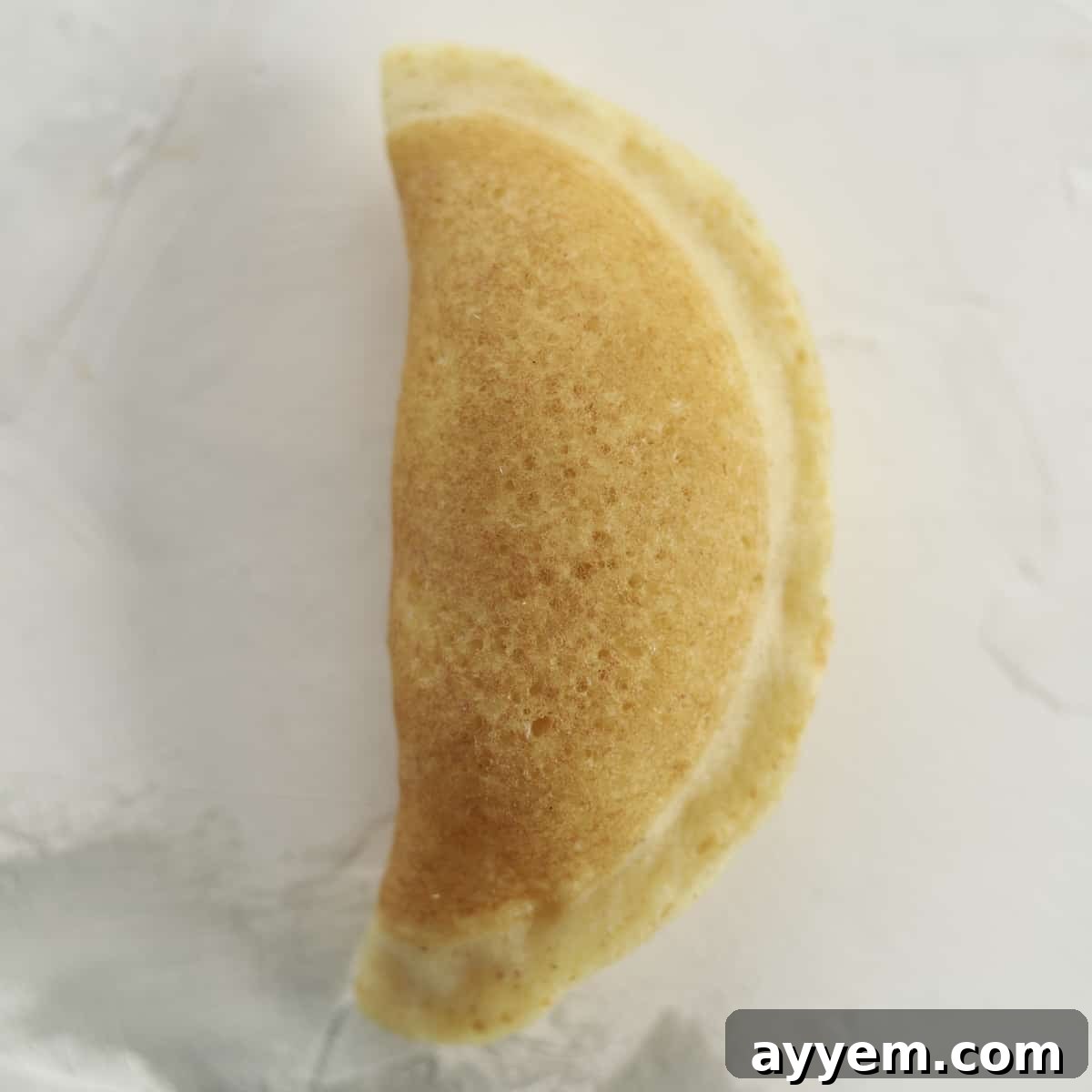 folded atayef stuffed with cream cheese