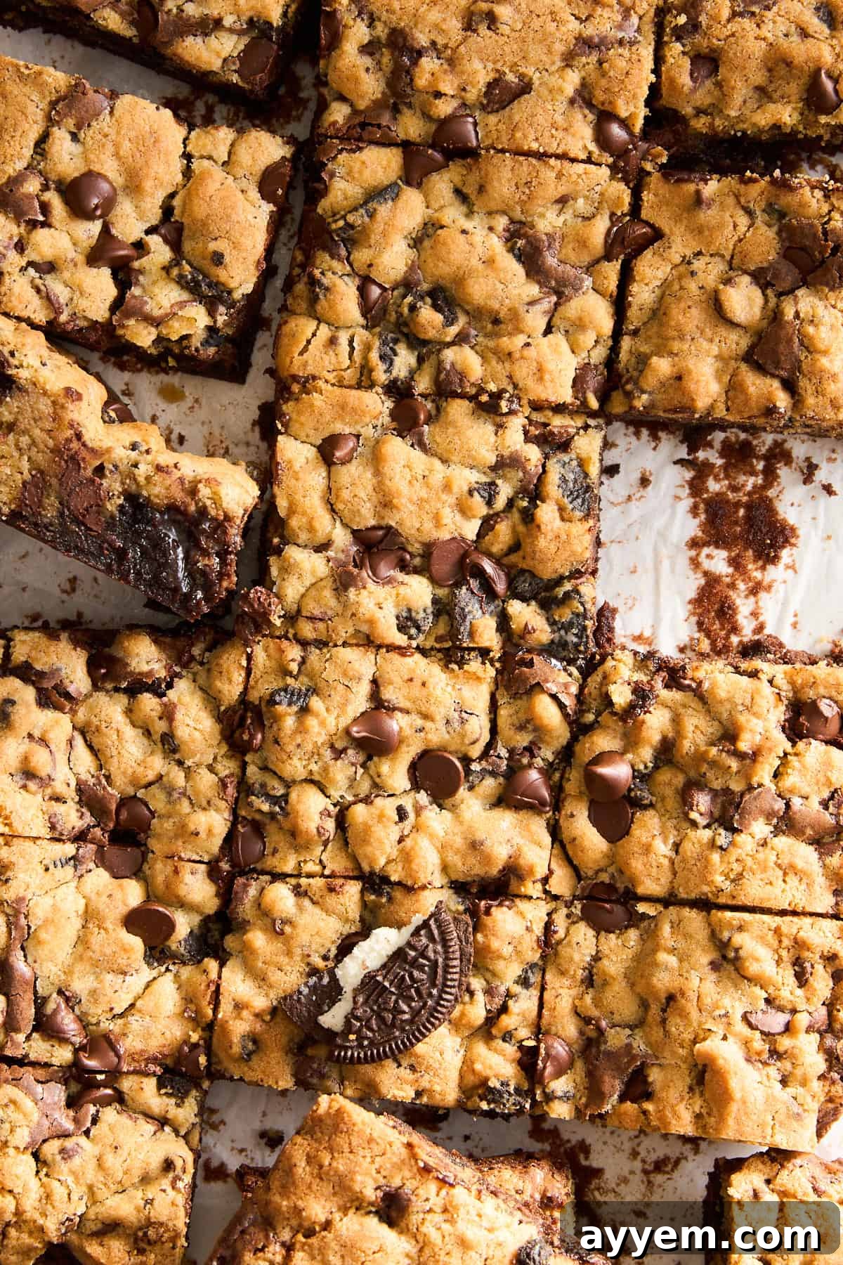 Individual slices of Oreo brookie bars, showing the distinct layers of brownie, cookie, and scattered Oreo pieces.