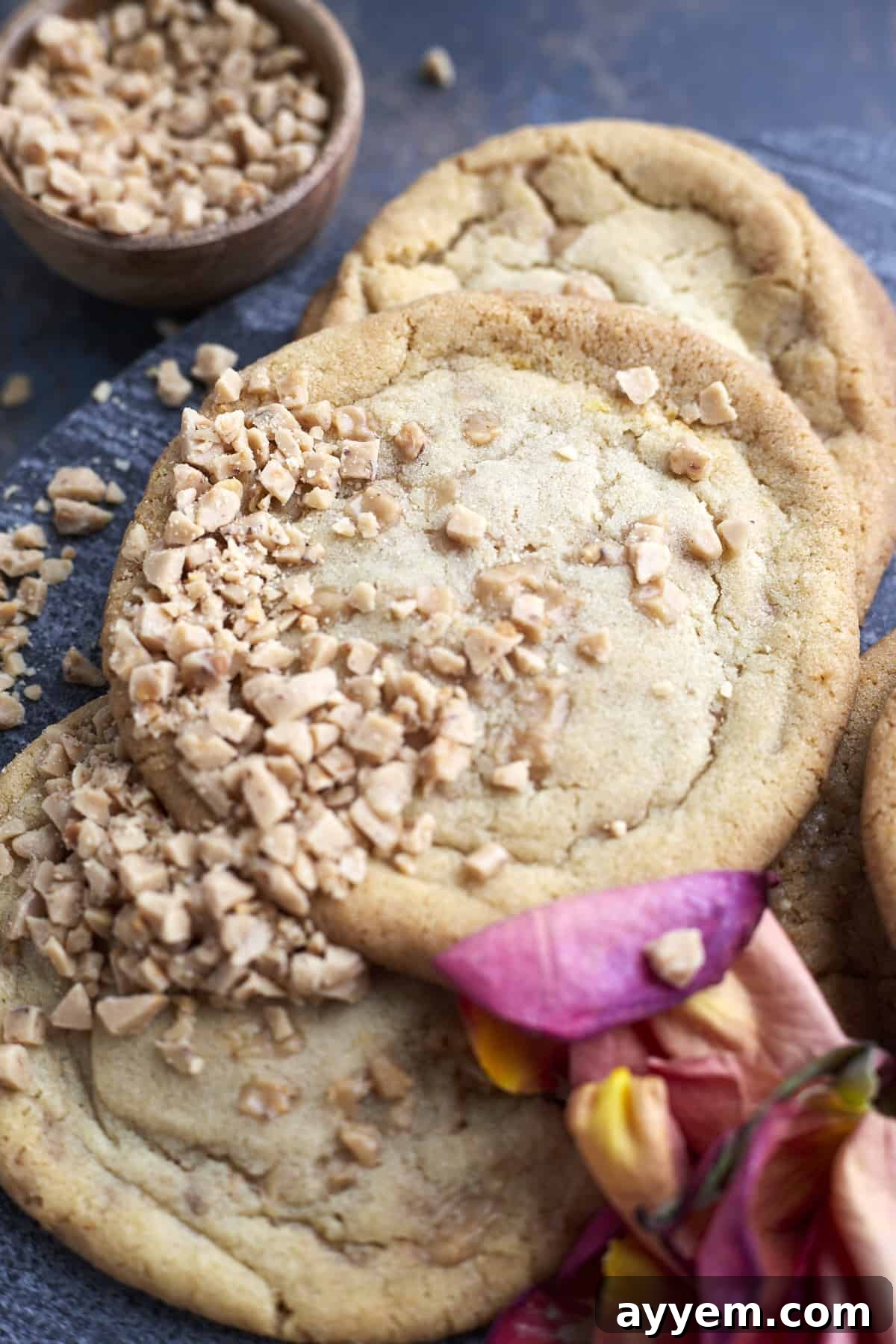 Close-up view of freshly baked brown butter toffee cookies with golden edges