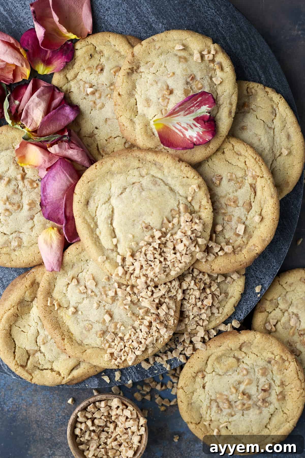 Overhead image of a batch of brown butter toffee cookies arranged neatly