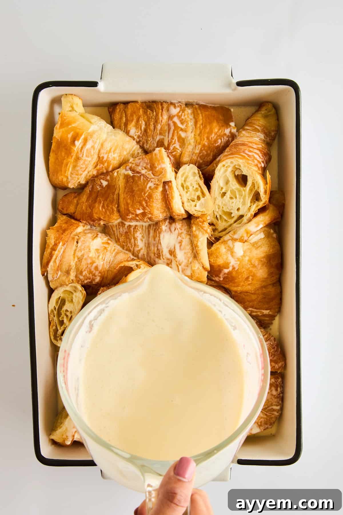Decadent Pecan Croissant Pudding 4 Mixing the creamy custard for pecan pie bread pudding.