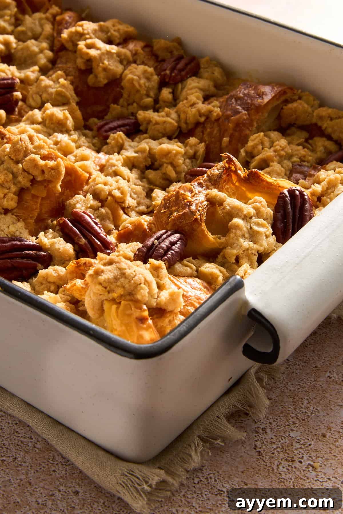 Decadent Pecan Croissant Pudding 7 Baked Pecan Pie Croissant Bread Pudding, golden and ready to serve.
