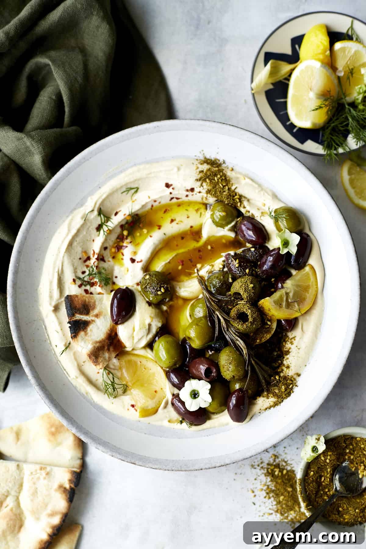 Make extra savory, ultra delicious roasted olives in the slow cooker for an easy snack or simple appetizer that can't be beat! 