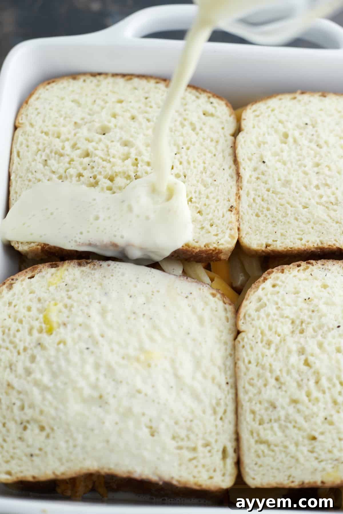 four unbaked fajita chicken sandwiches in a white square baking dish