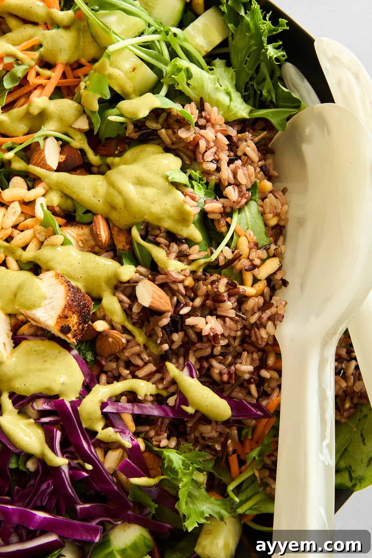 SweetGreen Crispy Quinoa Salad copycat, fully assembled with dressing being drizzled over.