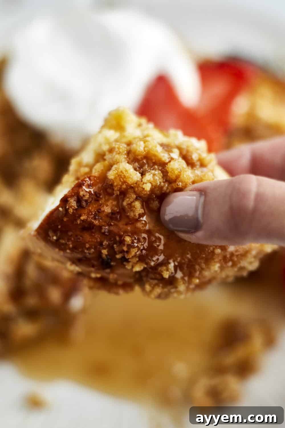 Overhead shot of the baked Cinnamon Crunch Bagel French Toast Casserole, showcasing its crunchy topping and golden color.