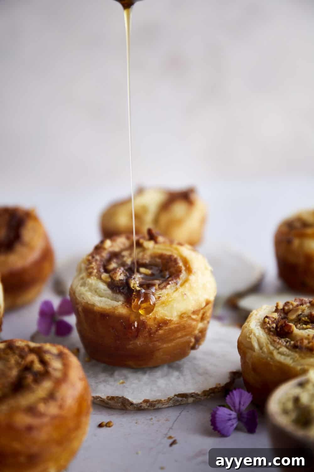 A plate of freshly baked Baklava Puff Pastry Cinnamon Rolls ready to be enjoyed.