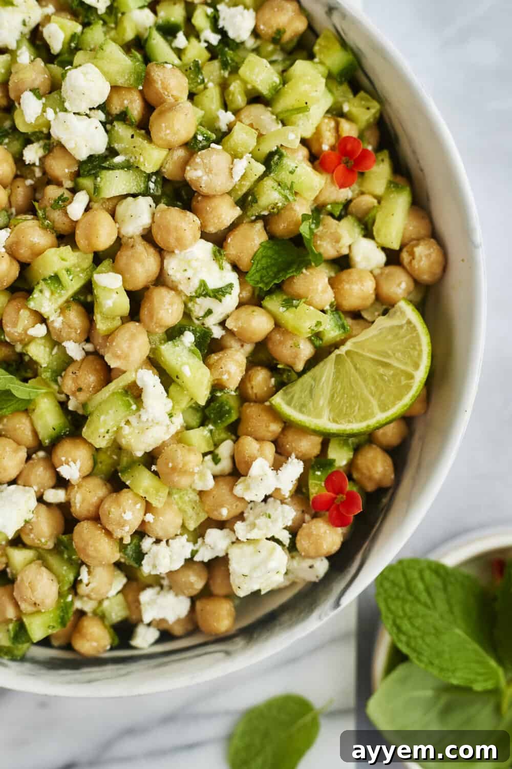 A bowl of Chickpea Cucumber Feta Salad ready to be served, showcasing its vibrant colors and textures.