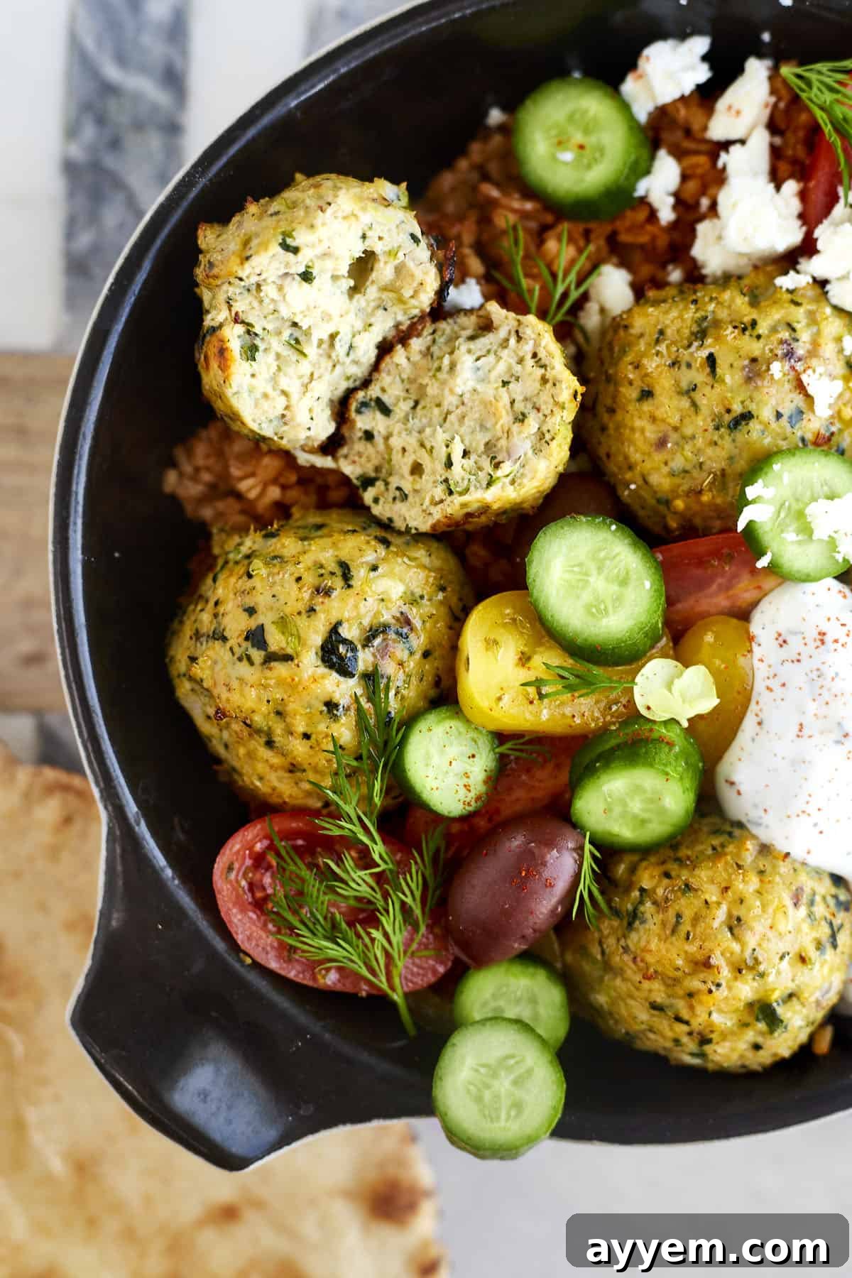 Greek meatball dinner with rice, veggies, and tzatziki