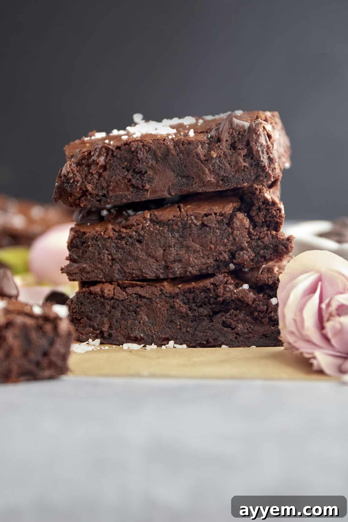 Stacked fudgy chocolate chip brownies with a sprinkle of sea salt