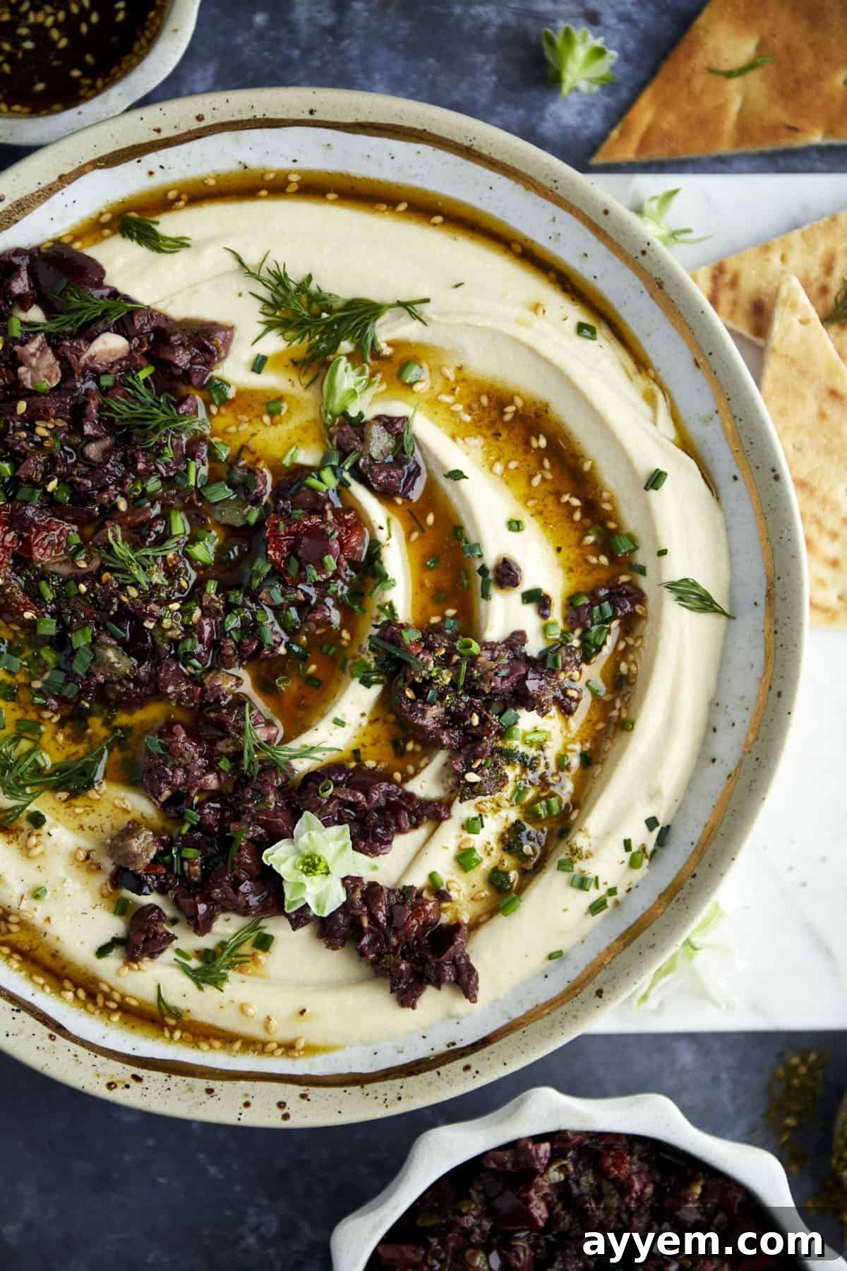 Za'atar Hummus with Olive Tapenade, ready for serving.