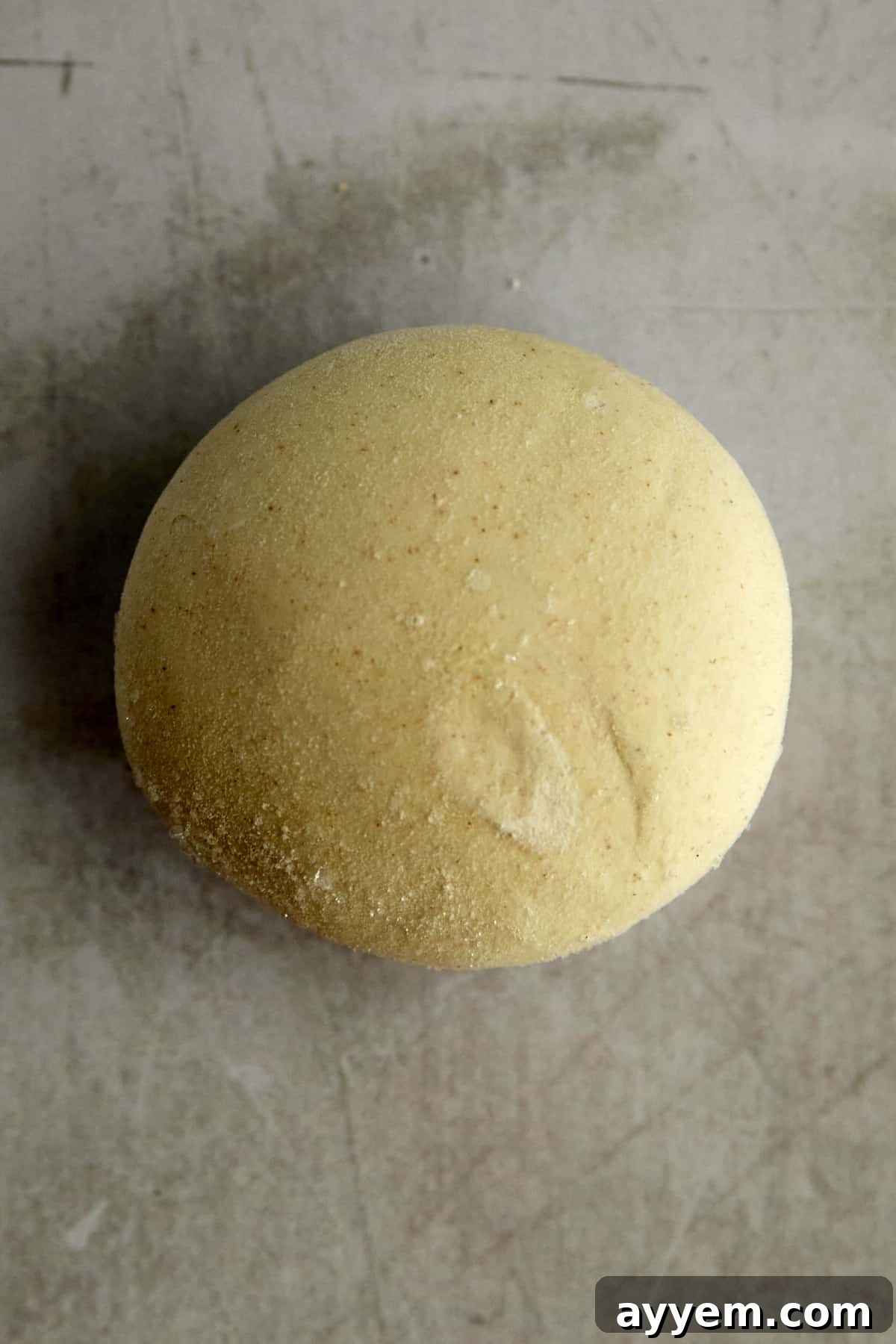 Lebanese Flatbread Wonders 4 Step 1: Frozen dinner rolls arranged on a baking sheet, ready for rising.
