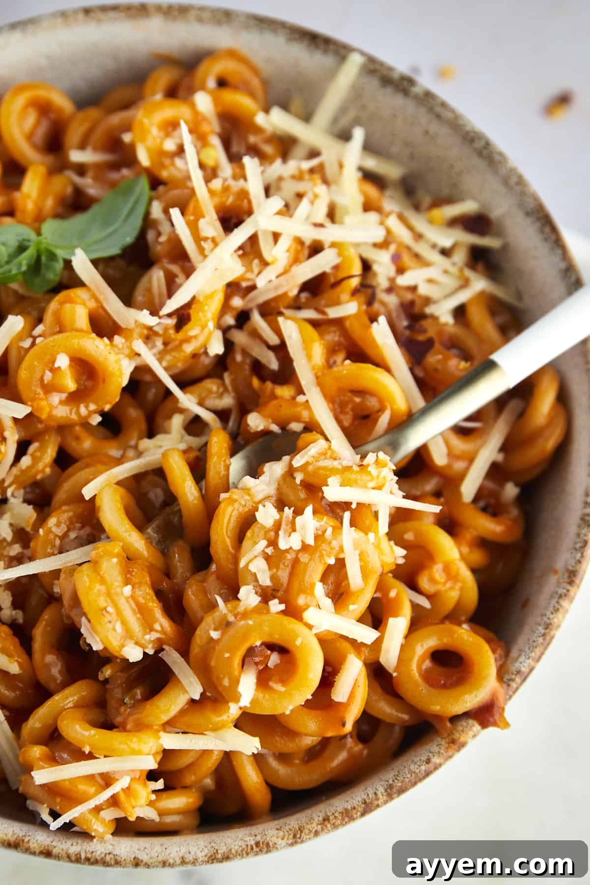 close up image of a spoonful of homemade spaghetti o's