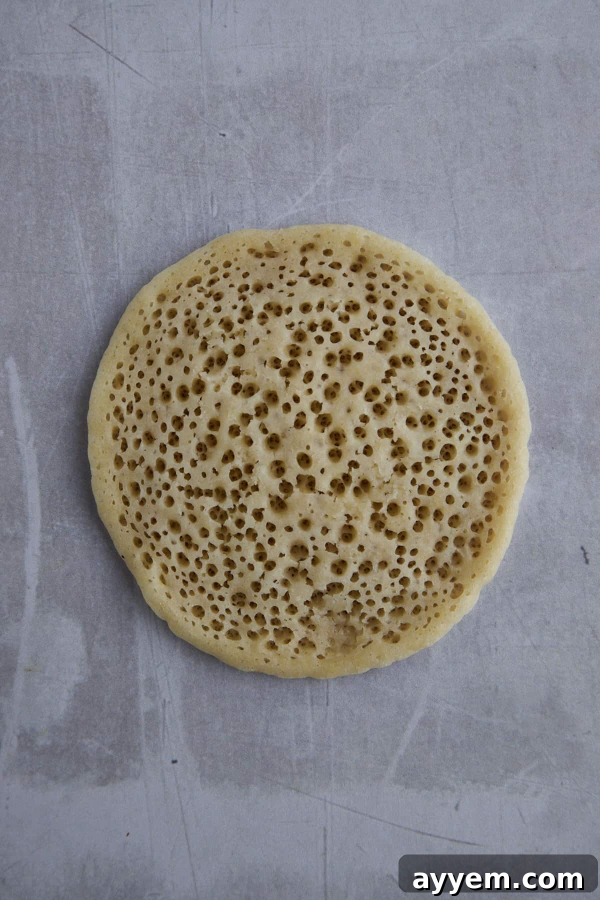 Uncooked Qatayef pancake ready for filling.