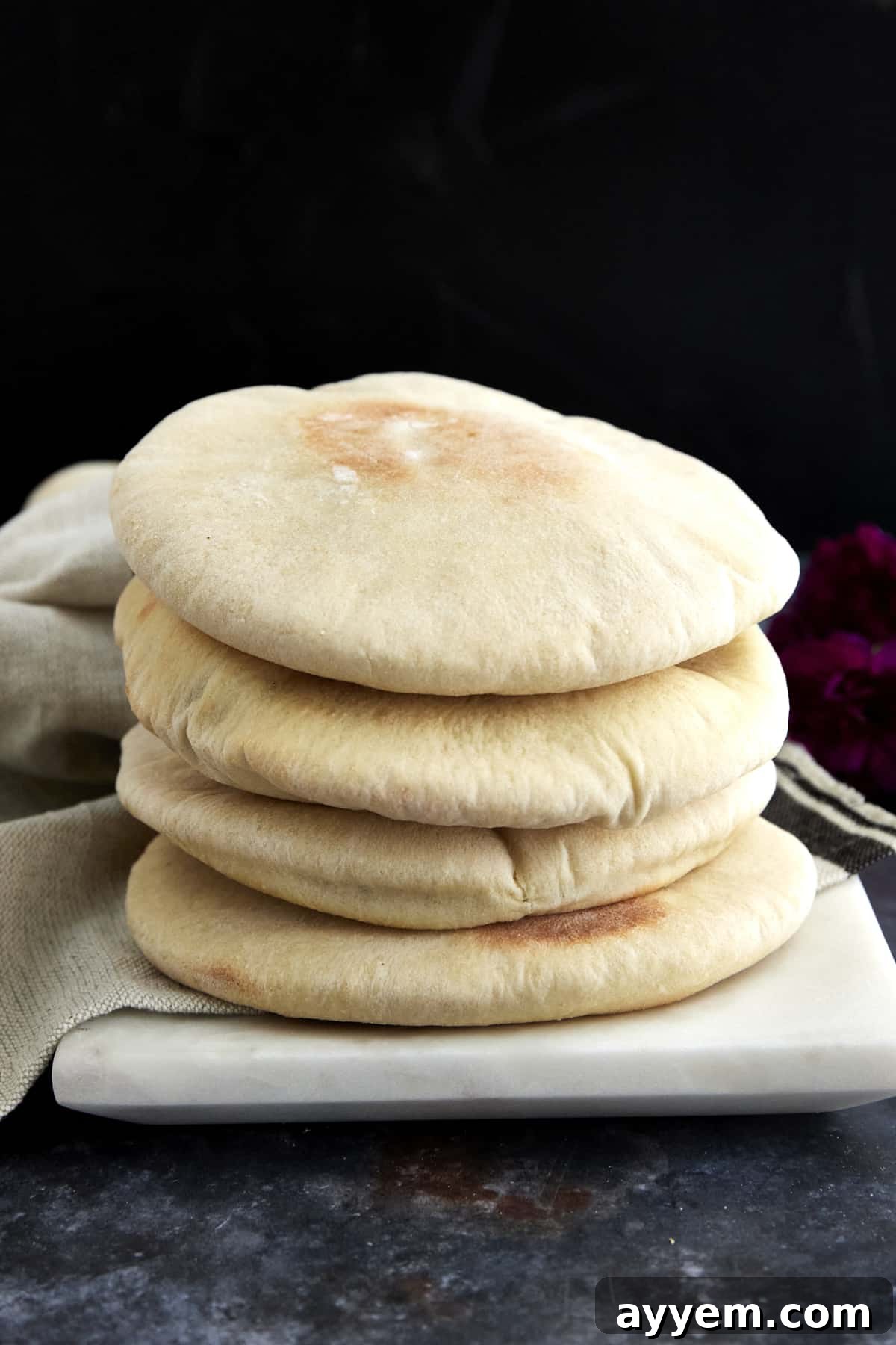 A stack of warm, homemade pita bread.