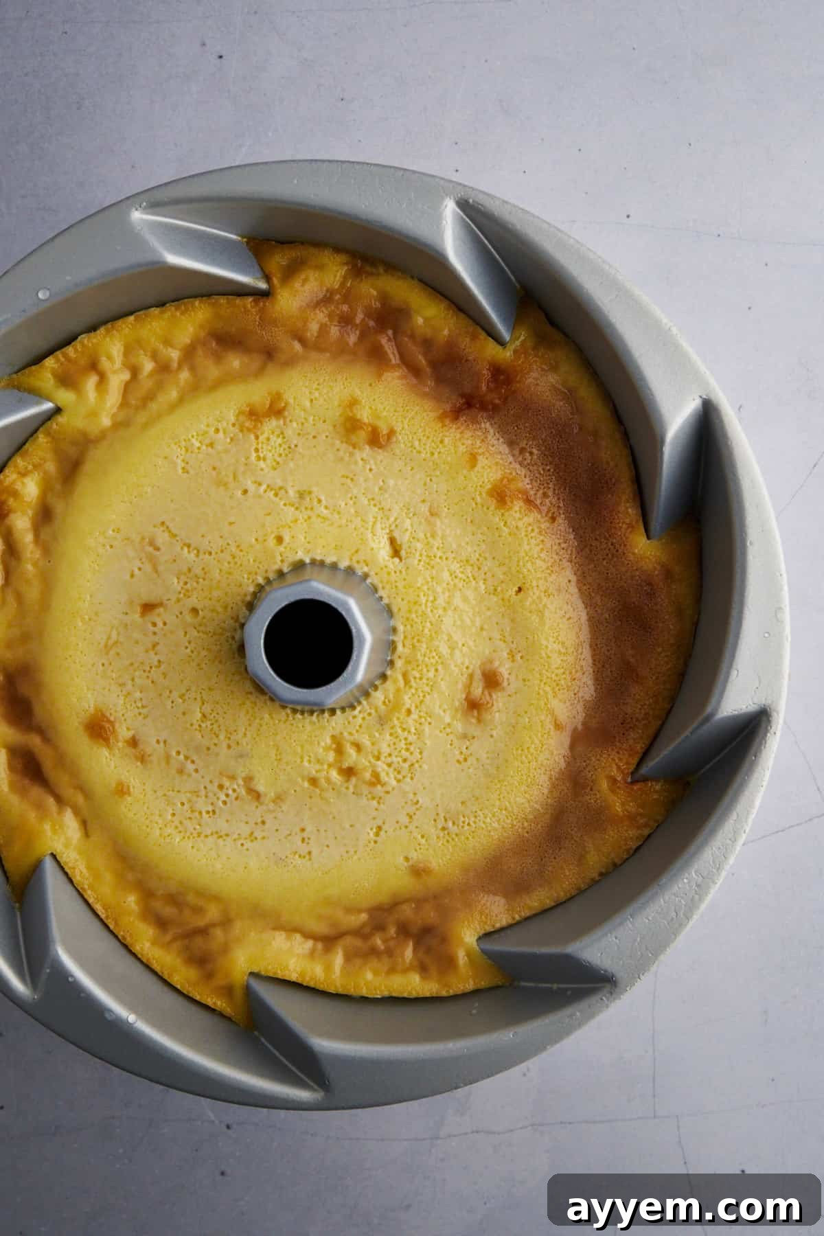 creme caramel recipe in a bundt pan, showing the rich caramel layer at the bottom.