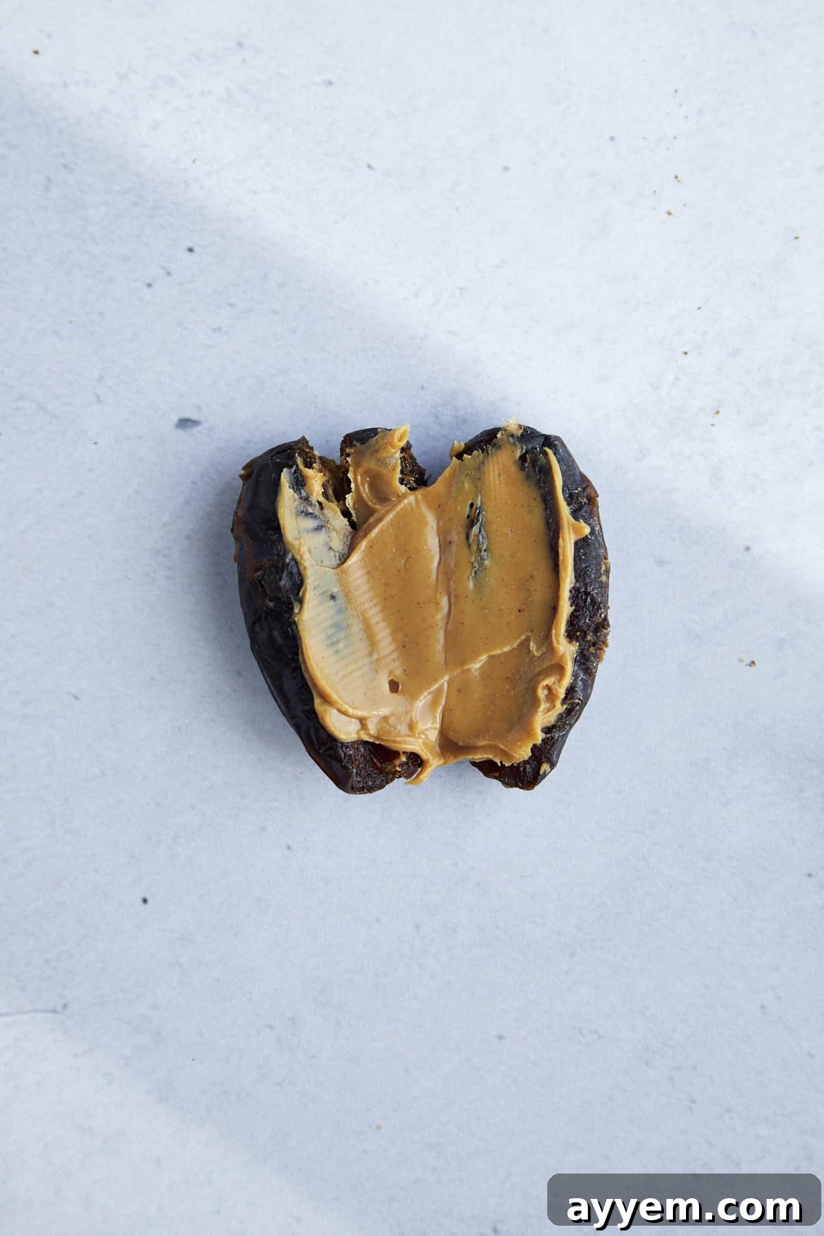 A sliced date stuffed with peanut butter. 