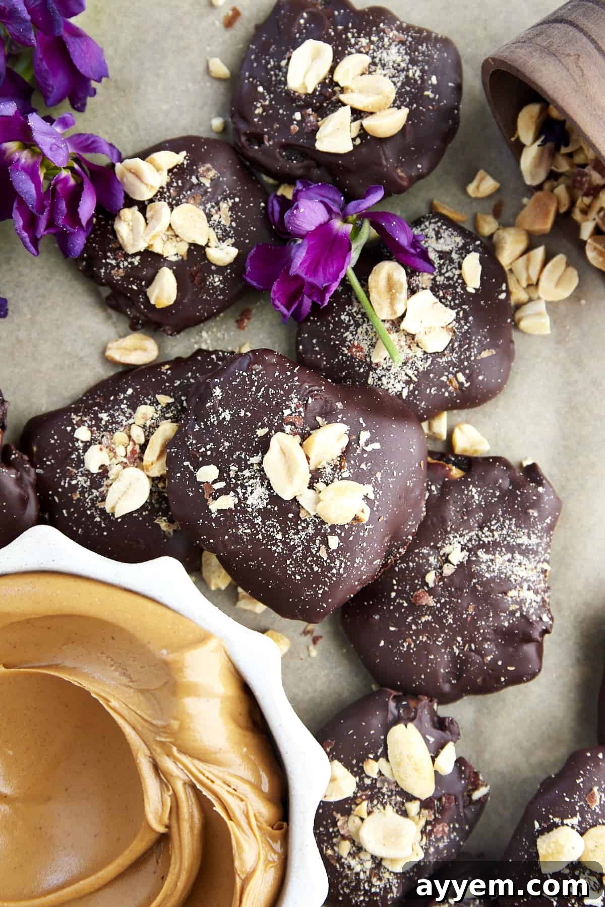 Chocolate covered dates with peanut butter topped with peanuts and flakey salt.