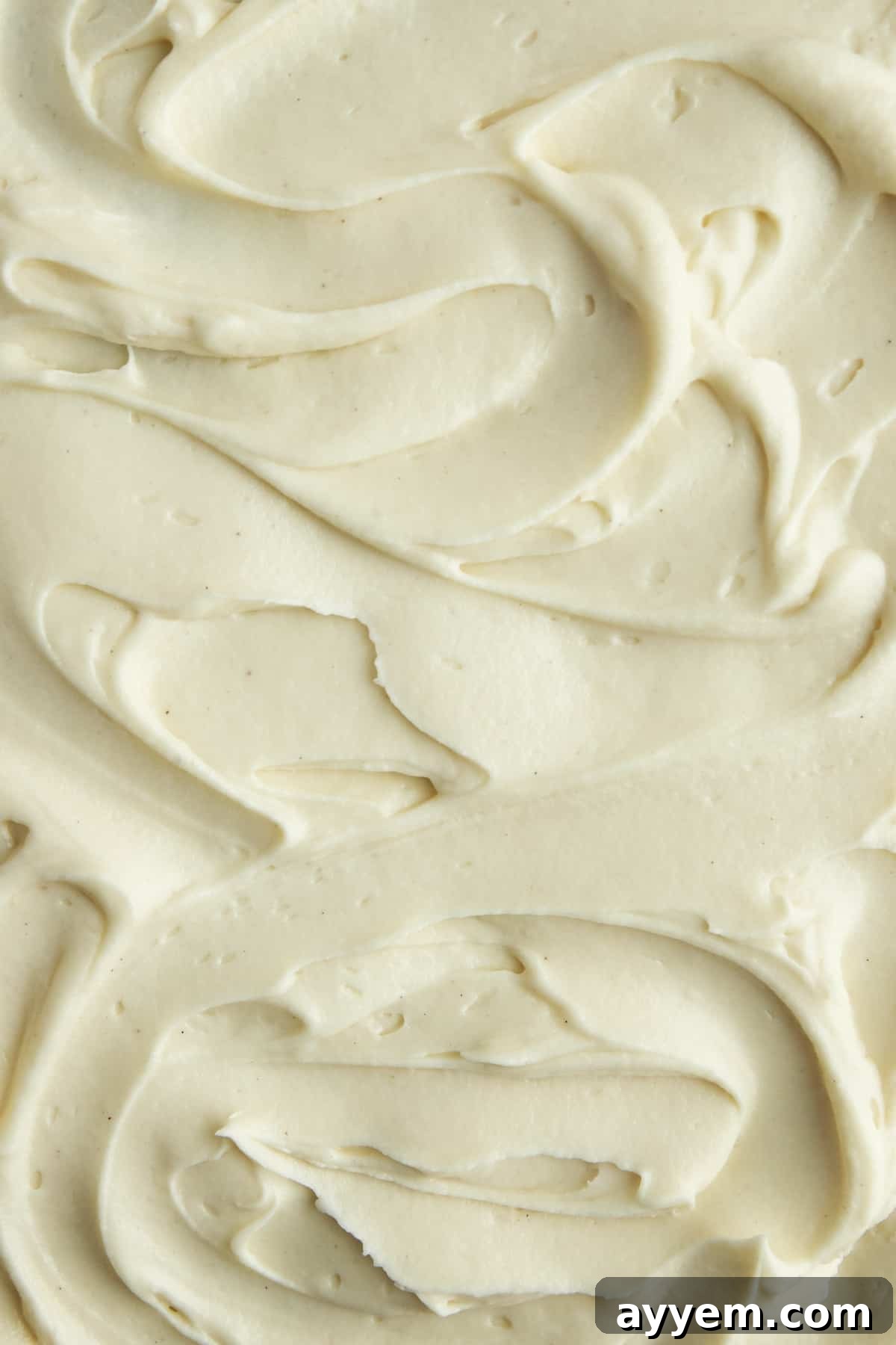 Close-up of homemade cream cheese frosting, smooth and fluffy.