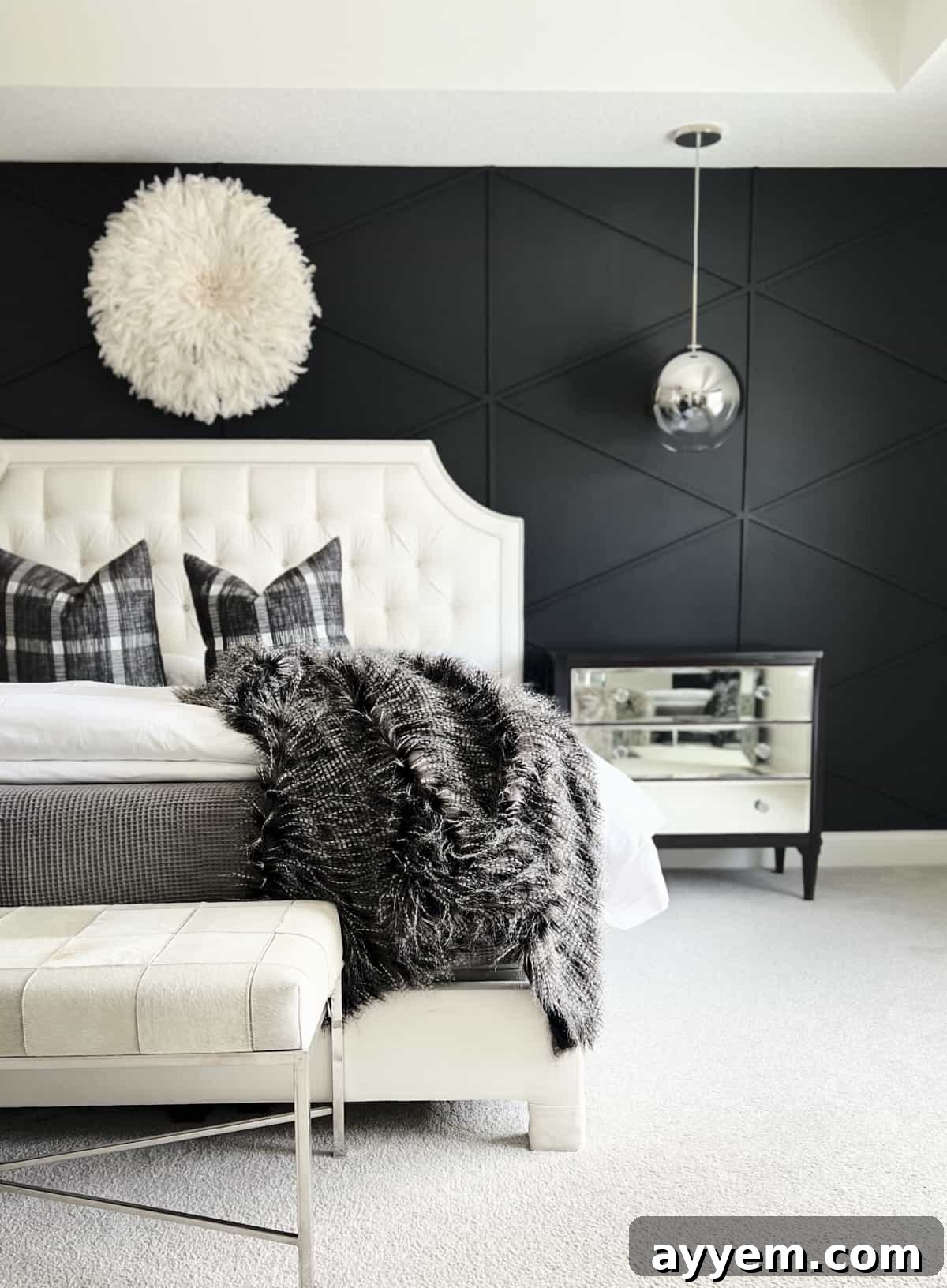 A black accent wall with wood plank diamonds in a bedroom, featuring modern minimalist decor.