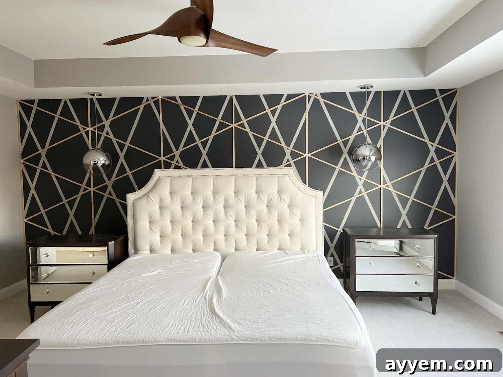 An accent wall featuring a unique geometric pattern created with wood planks.