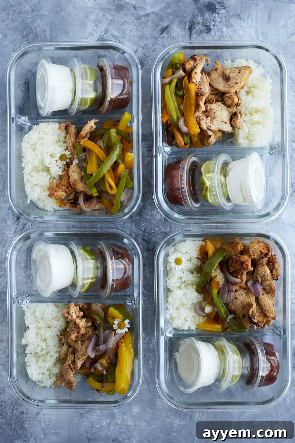 4 chipotle chicken meal prep boxes with onions, peppers, and sides of salsa, guacamole, and sour cream, neatly packed.