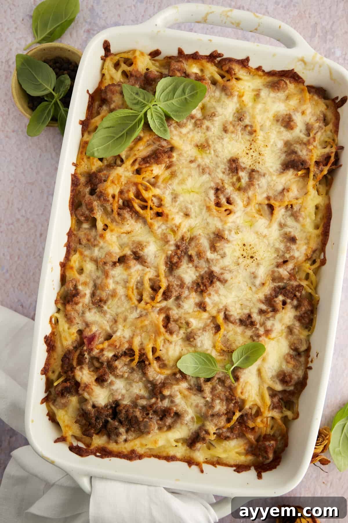 A rich and cheesy million dollar spaghetti casserole, baked to golden perfection.